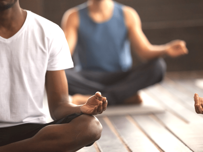 Self-care at SHIFT: Two men meditating