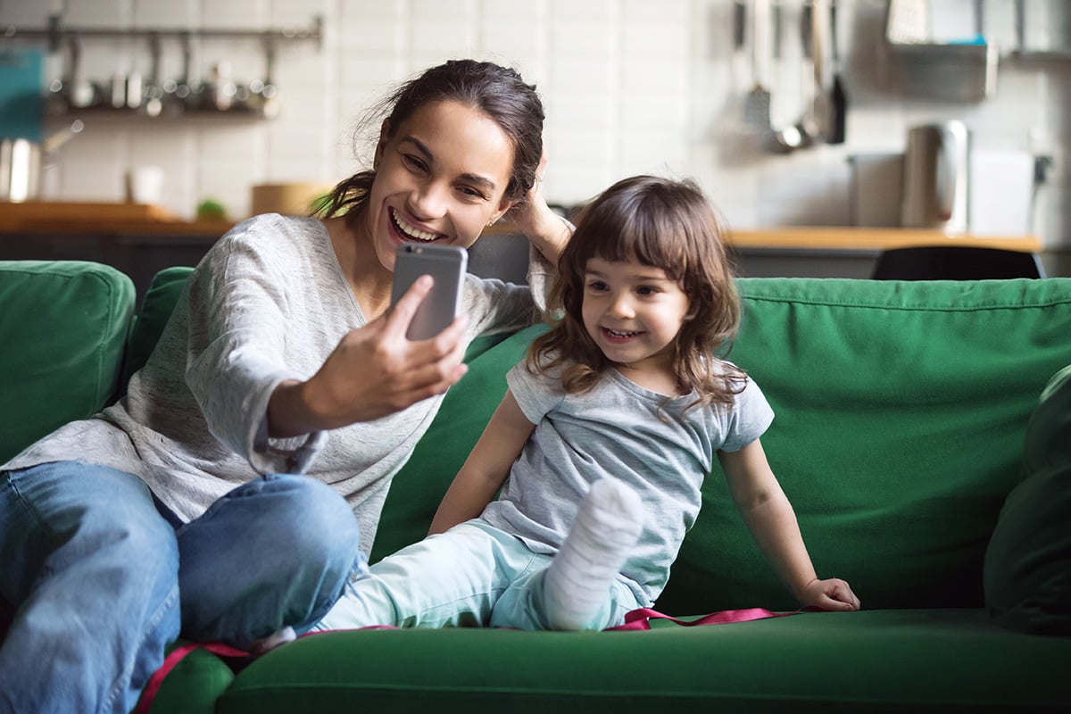 Woman and child video calling on the phone