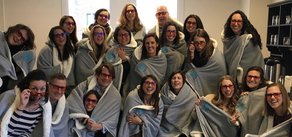 7 Essentials of a Great Place to Work: A cozy group photo of employees