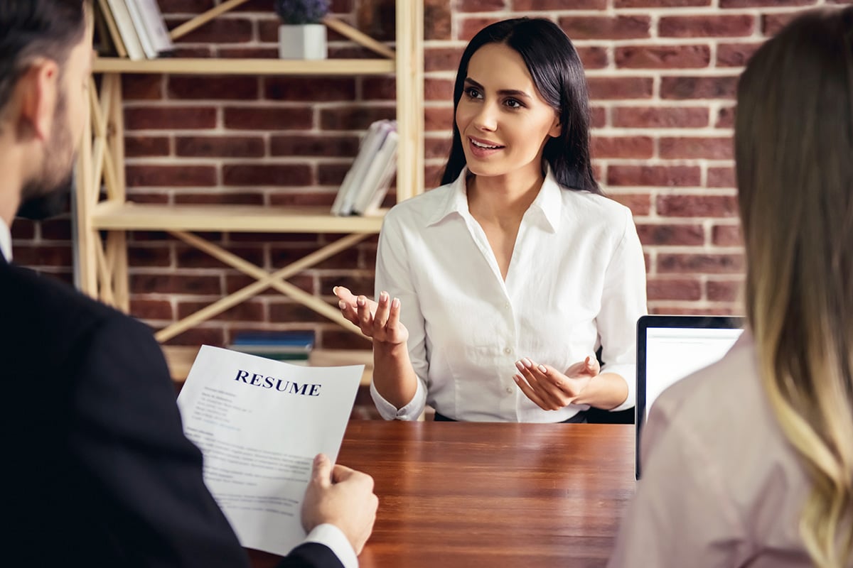 Two women interviewing another woman for a job